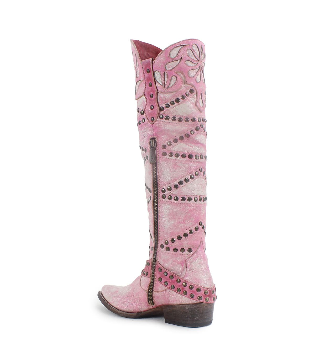 The "Betting" boot by Bed Stu is a pink leather knee-high Western boot with cutout floral designs, stud detailing, a decorative harness strap, and a convenient side zipper.