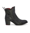 A women's black ankle boot with red detailing, called Bia by Bed Stu.
