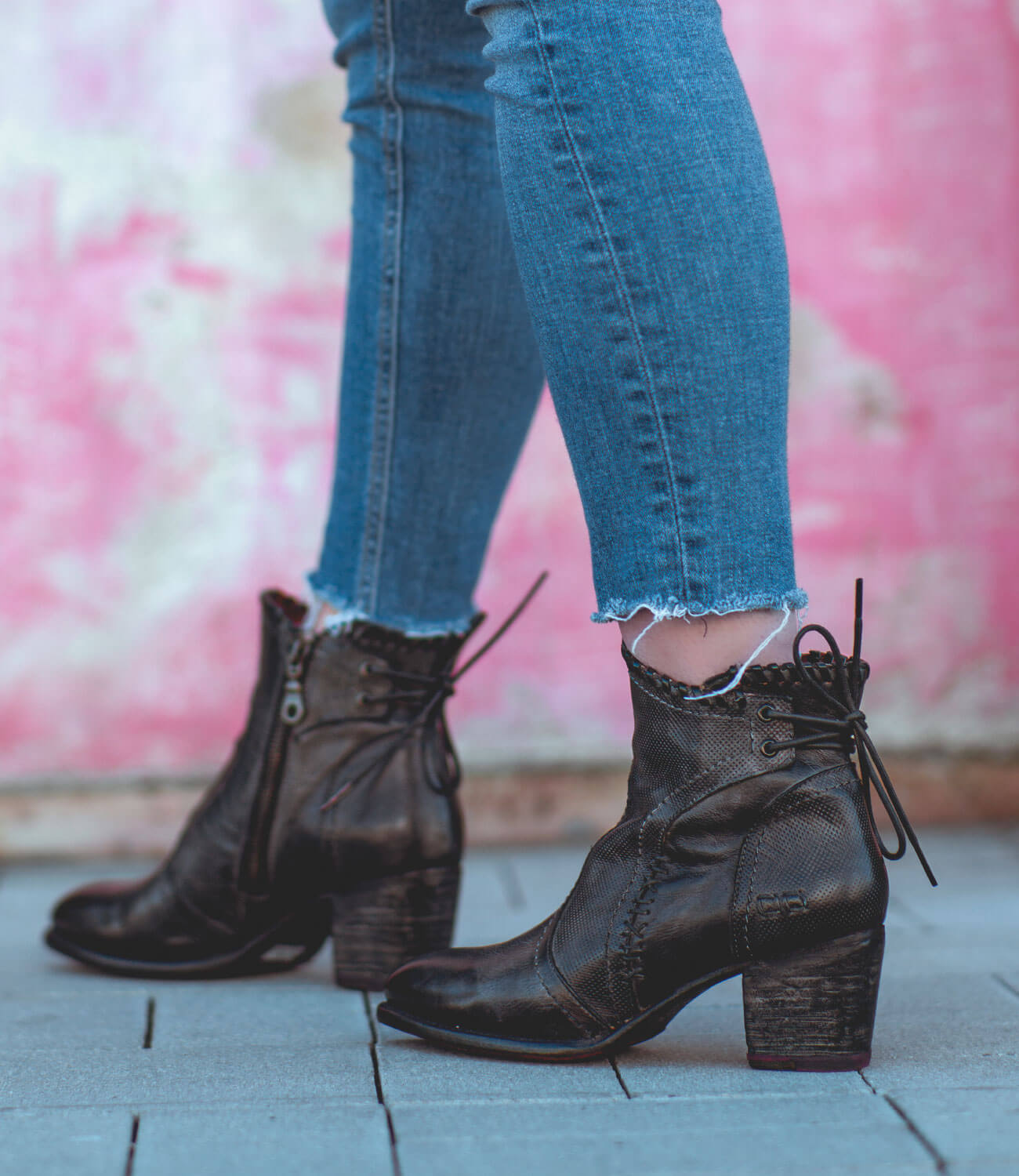 A woman wearing Bia jeans and Bed Stu black ankle boots.