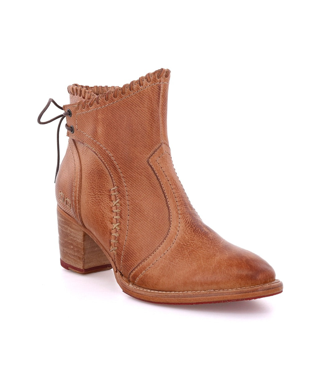 A women's tan ankle Bia boot with a wooden heel by Bed Stu.