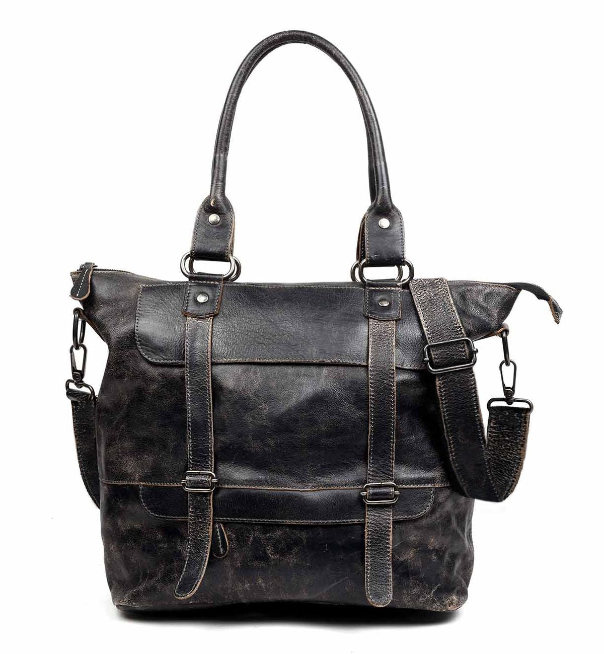 The Big Fork by Bed Stu is a black leather tote bag featuring two handles, front straps, and an adjustable crossbody strap. Meticulously crafted from full grain leather, the bag boasts a weathered look complemented by metal buckle accents.