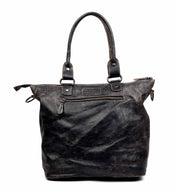 A black leather Big Fork tote bag on a white background by Bed Stu.