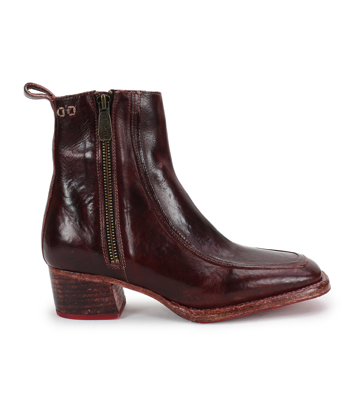 The Bitsy by Bed Stu is a single dark brown ankle boot in hand-finished leather, featuring a side zipper, back pull tab, square toe, and low stacked wooden heel.
