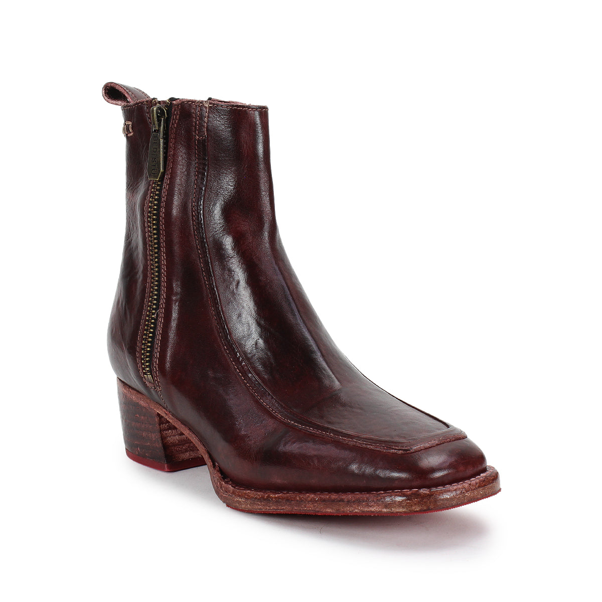 The Bed Stu Bitsy is a single brown leather ankle boot with a side zipper and a low stacked wooden heel, crafted from hand-finished leather and displayed on a white background.