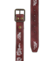 The Bed Stu Blaze JB is a brown full-grain leather belt with white embroidered scrollwork and an antique-finished buckle, shown from the front and tip ends.