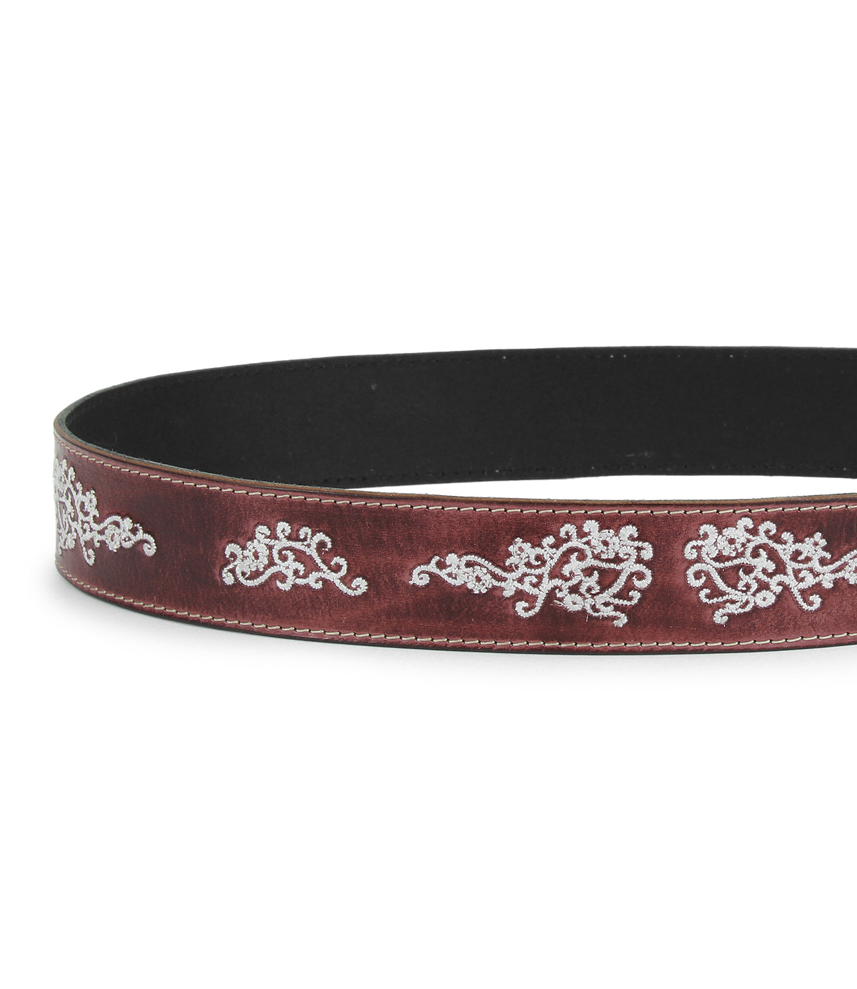 The Blaze JB by Bed Stu is a brown full-grain leather belt with white swirling embroidered scrollwork along the edge, finished with an antique-style buckle.