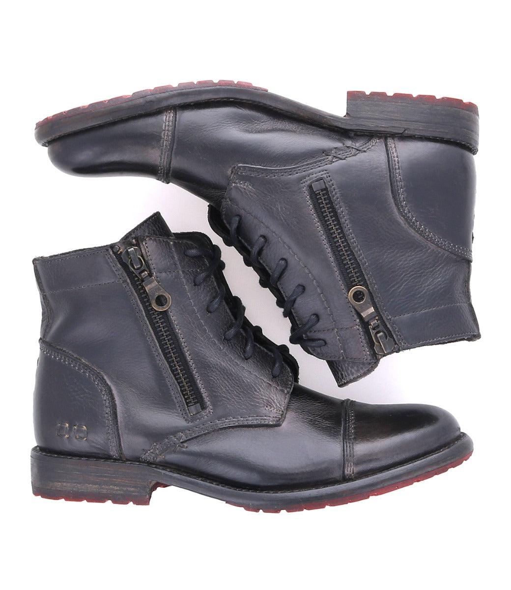 A pair of Bed Stu Bonnie II women's black leather boots with zippers.