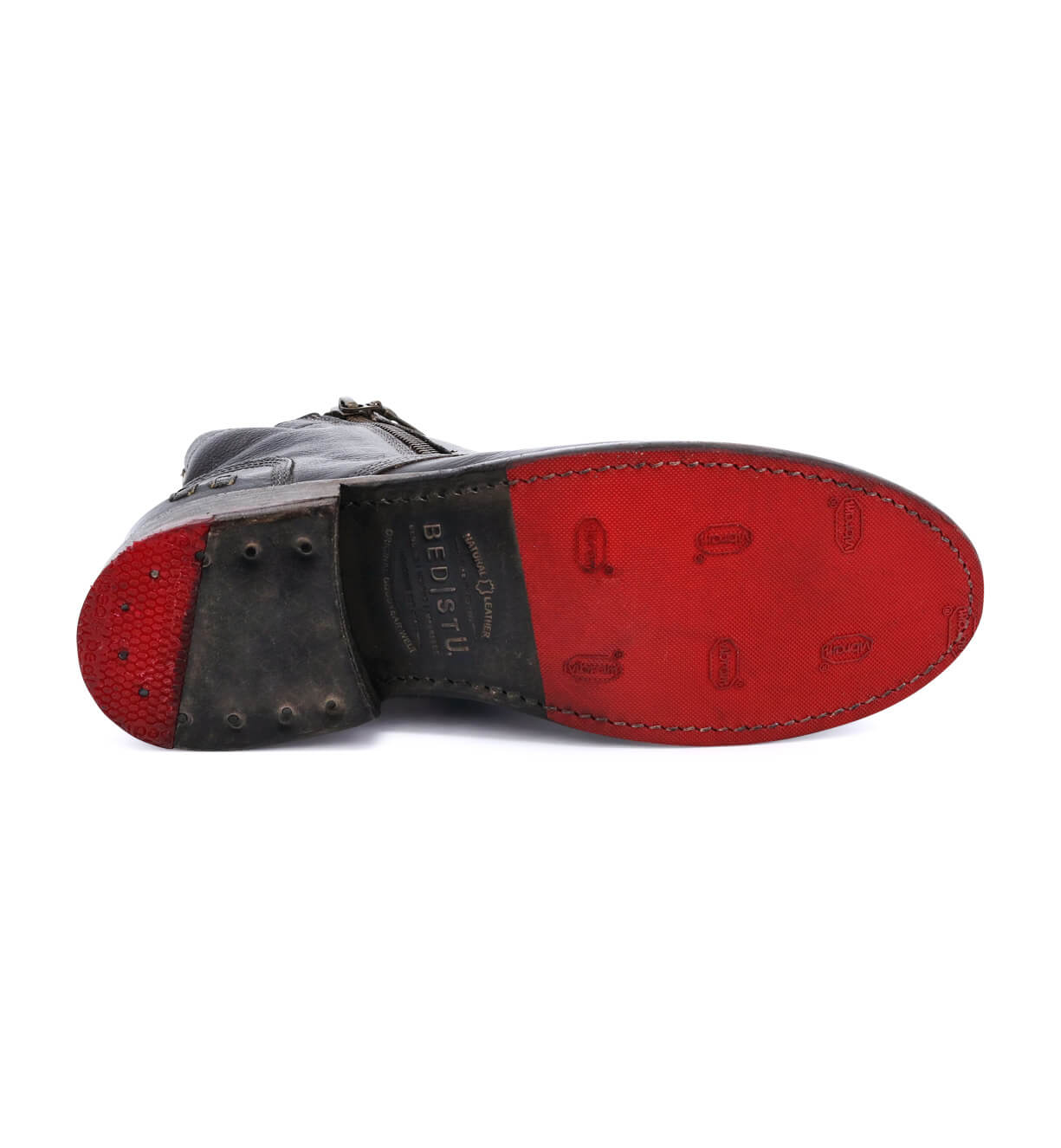 A pair of enduring Bed Stu Bonnie black lace-up shoes with red soles on a white background.