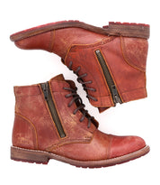 A pair of Bonnie II boots by Bed Stu, made of red leather with zippers.