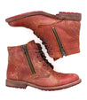 A pair of Bonnie II boots by Bed Stu, made of red leather with zippers.