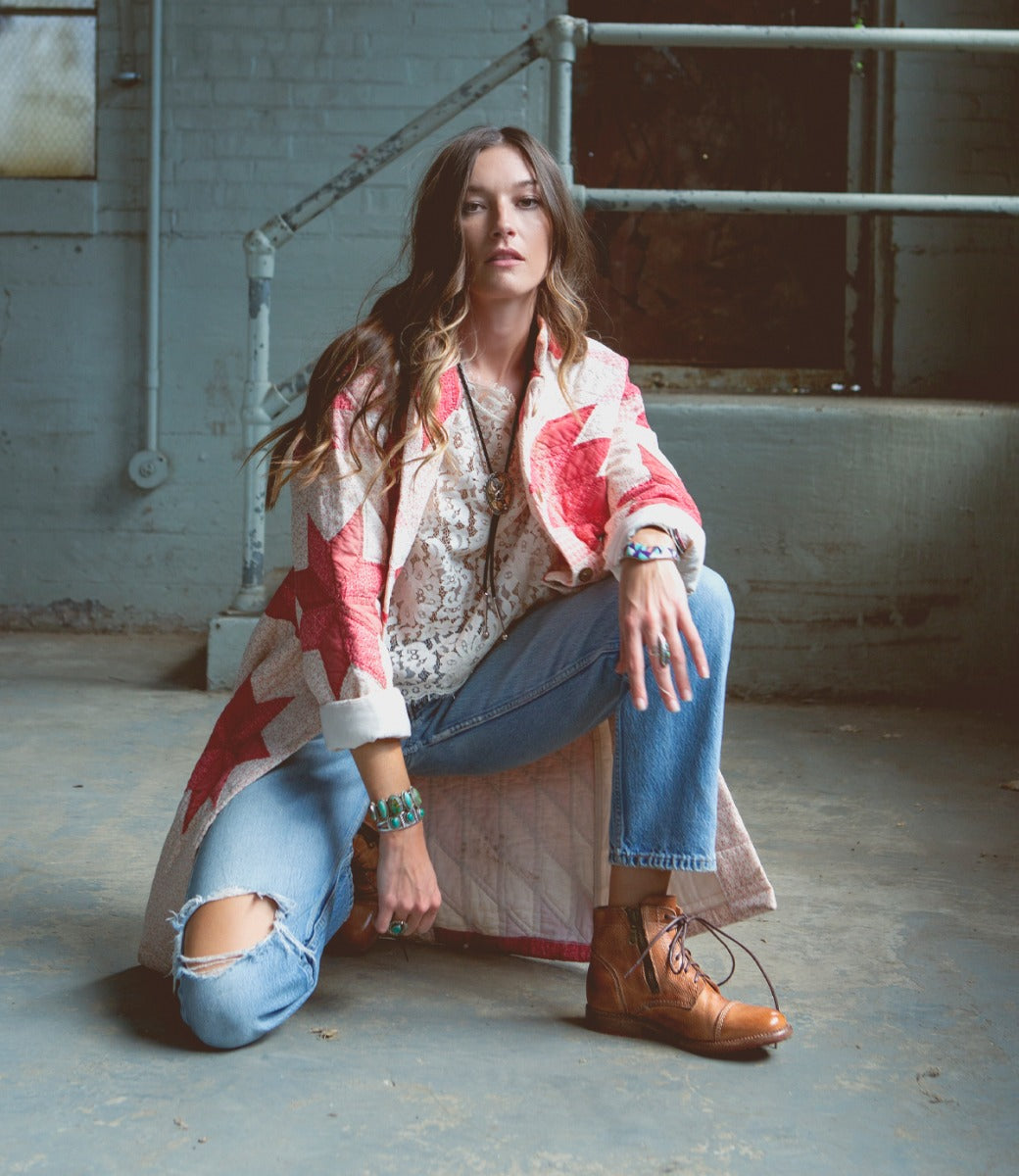 A woman wearing a pair of Bed Stu Bonnie II tan boots.