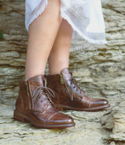 A woman in Bed Stu Bonnie II boots.