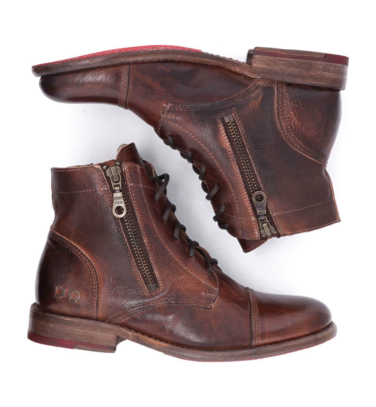 A pair of Bonnie by Bed Stu lace-up brown leather combat ankle boots.