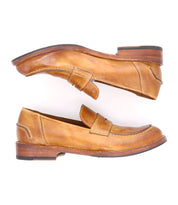A pair of Bed Stu Italian leather penny loafers with a distressed finish on a white background.