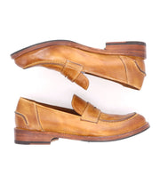A pair of Bed Stu Italian leather penny loafers with a distressed finish on a white background.