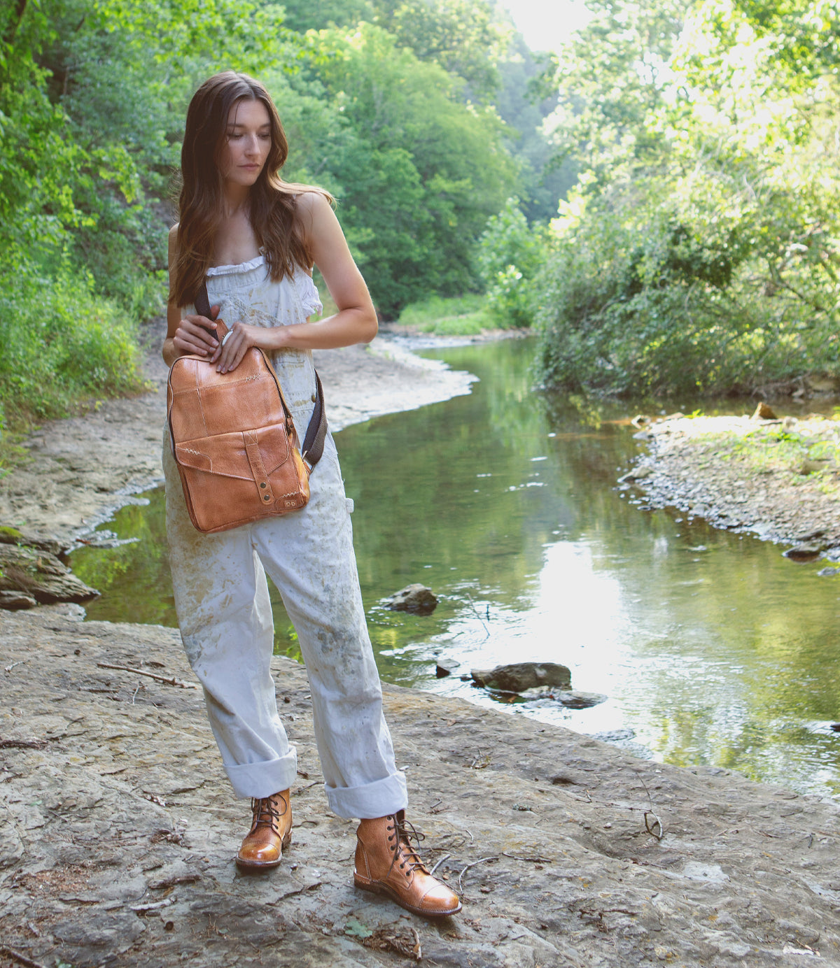 A woman wearing a Bed Stu Boss bag.