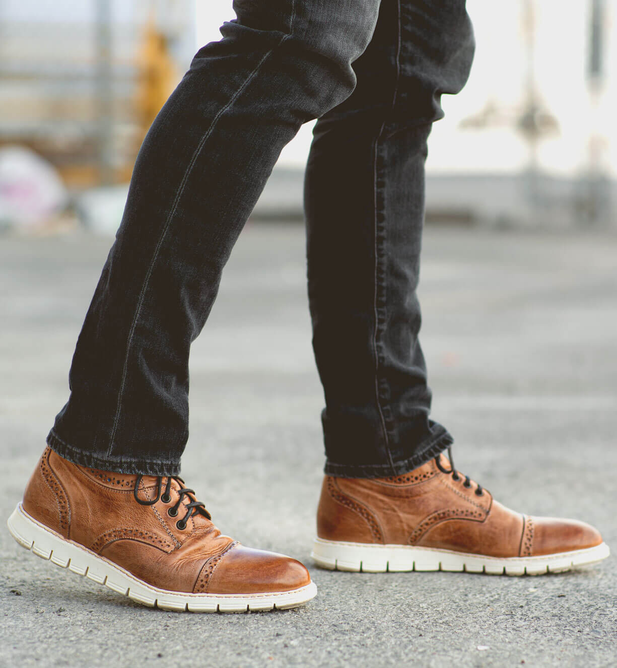 A man wearing a pair of Bed Stu Bowery II tan lace up shoes.