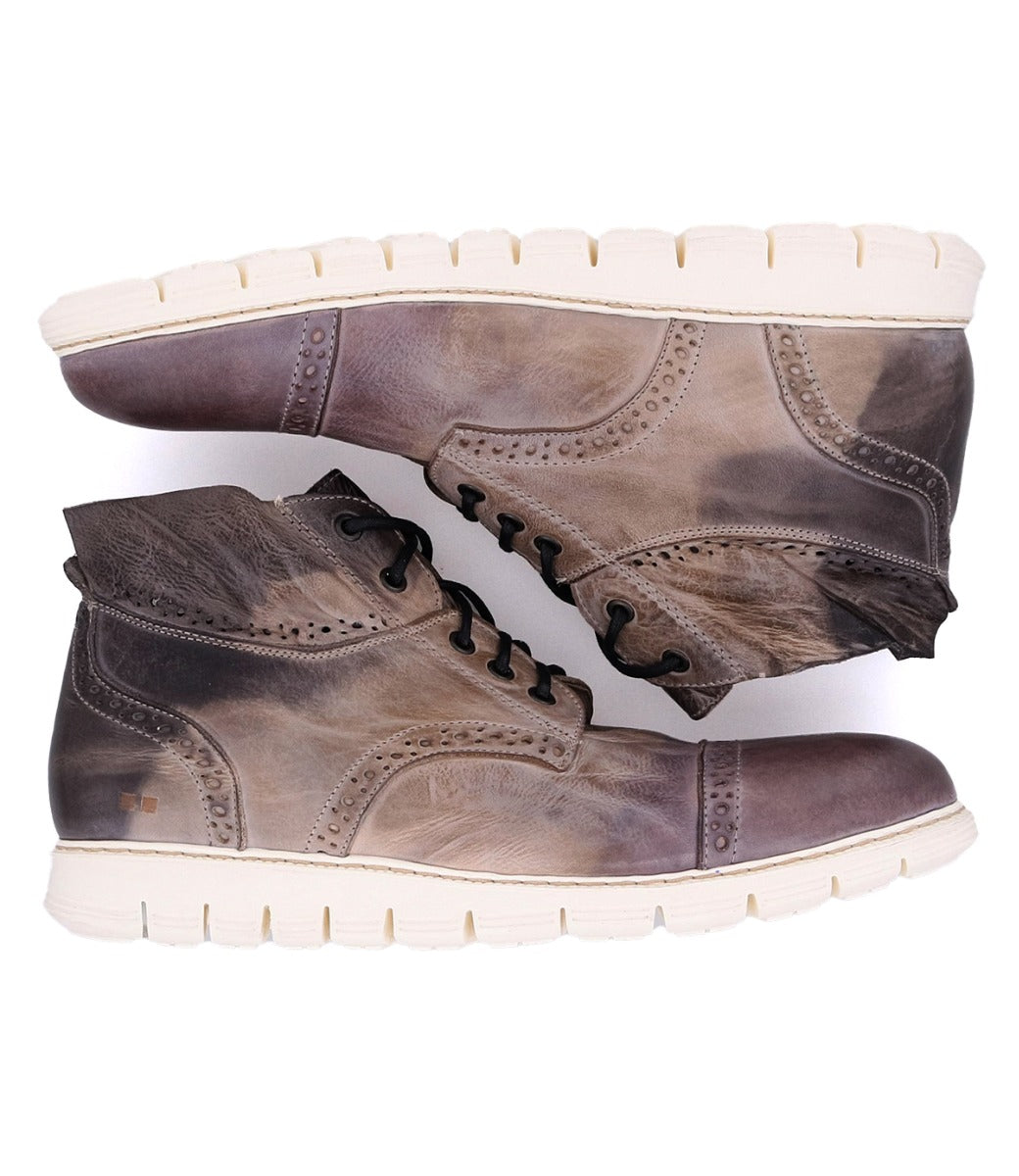 A pair of Bowery II brown leather boots with a white sole by Bed Stu.