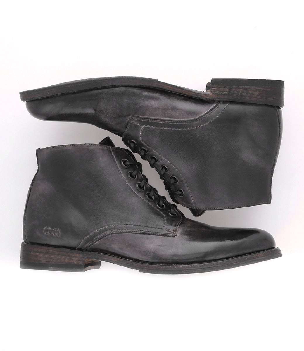 A pair of Bed Stu Bradley Black Rustic boots, featuring a cushioned insole, displayed against a white background.