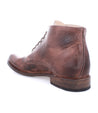 Brown leather ankle boot with laces, cushioned insole, showing wear and creasing, isolated on a white background. It is a Bradley by Bed Stu.