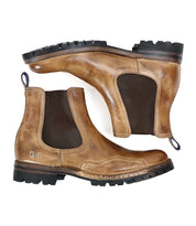 A pair of brown leather Bed Stu Brady Trek Chelsea boots with dark elastic side panels and rugged Vibram outsoles, shown from the side and bottom views.
