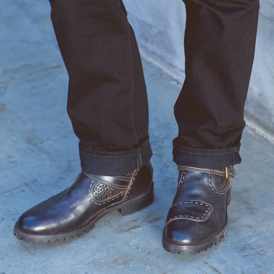 A man wearing a pair of Bed Stu Brando shoes.