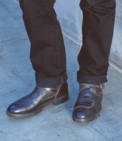 A man wearing a pair of Bed Stu Brando shoes.