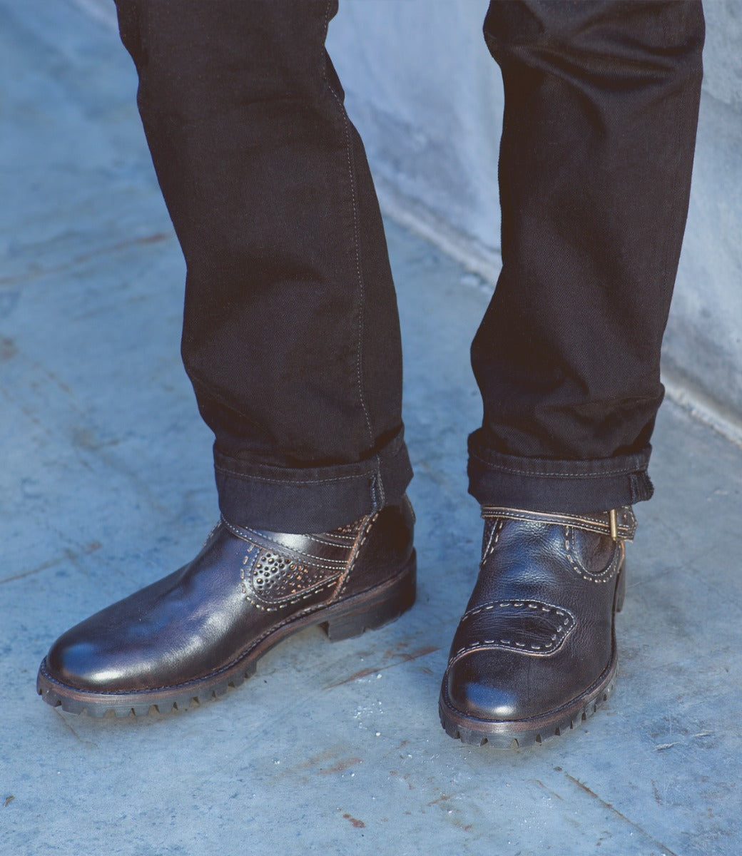 A man wearing a pair of Bed Stu Brando shoes.