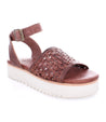 A women's Brisa sandal by Bed Stu with braided straps and a white sole.