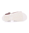 A pair of brown Brisa sandals with white soles on a white background by Bed Stu.
