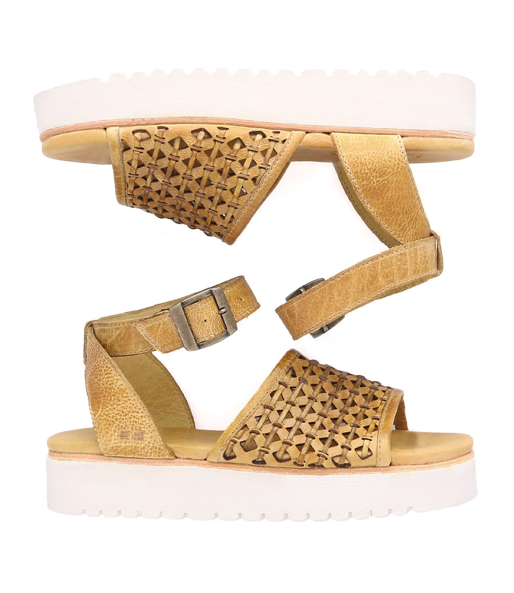 A pair of Brisa sandals by Bed Stu with white soles.