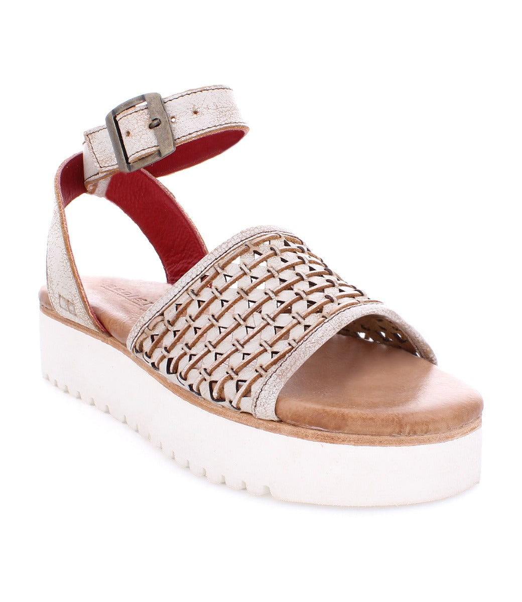 A women's Brisa sandal with braided straps and a white sole by Bed Stu.