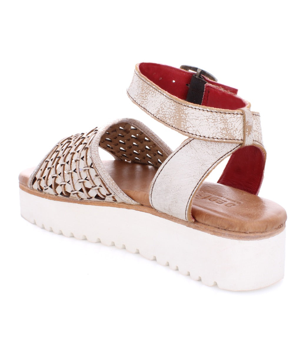 A women's sandal with braided straps and a white sole, the Brisa by Bed Stu.