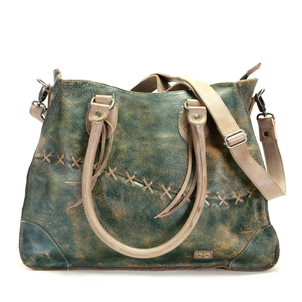 A teal Bed Stu Bruna leather bag with straps.