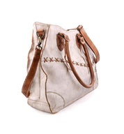 A white and tan Bed Stu Bruna pure leather bag with straps.