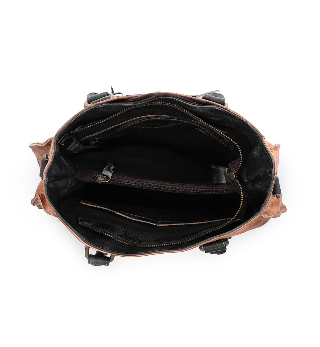Inside of a tan Bed Stu Bruna leather bag with black handles.