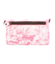 The Bed Stu Cadence is a pink and white marbled clutch with a top zipper and side-attached white strap, offering a chic 3-in-1 design that transitions smoothly from compact wallet to elegant crossbody.