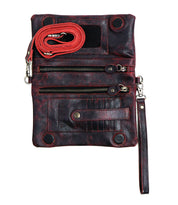The Cadence by Bed Stu is a black leather crossbody shoulder bag with red stitching, featuring multiple zippered pockets, a wrist strap, and a detachable red shoulder strap that effortlessly transforms it into a stylish clutch.