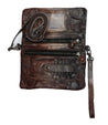 A versatile Cadence Speed by Bed Stu brown leather purse with a zipper and a strap.