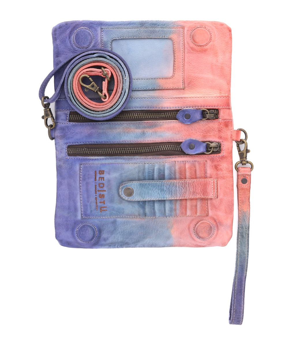 A Cadence purse with a pink and blue tie dye pattern by Bed Stu.