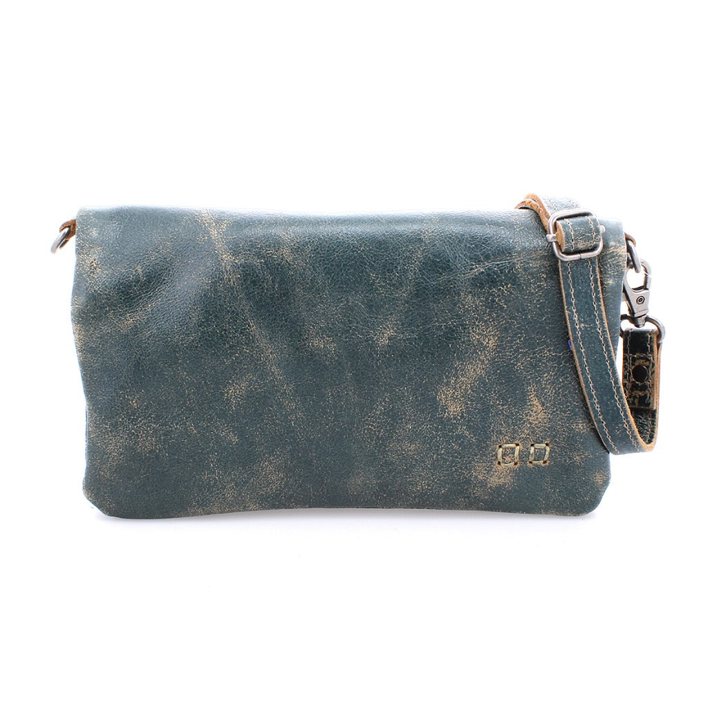 A Bed Stu Cadence teal leather cross body bag with a strap.