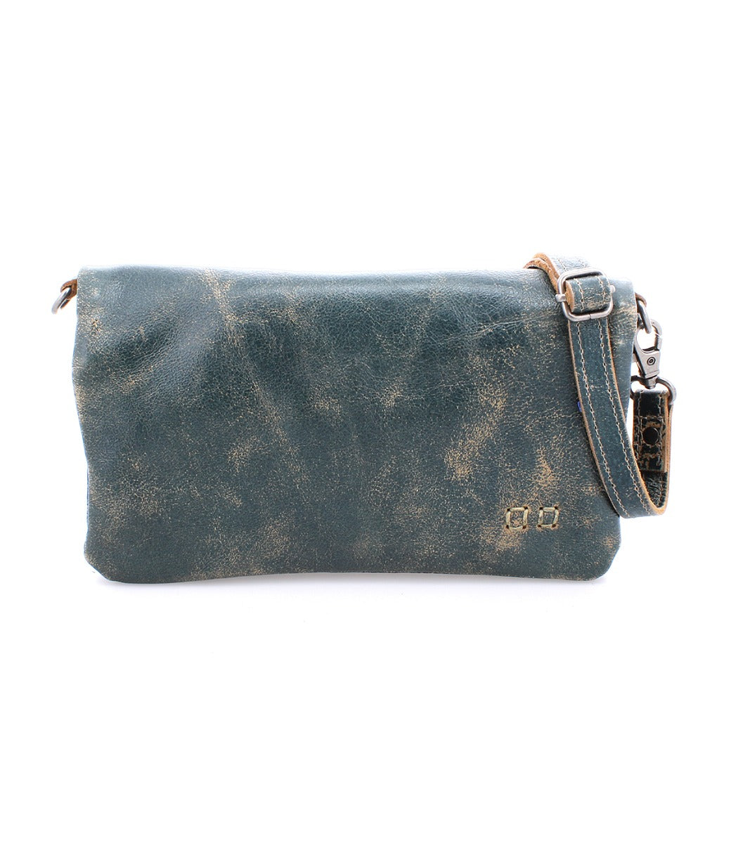 A Bed Stu Cadence teal leather cross body bag with a strap.