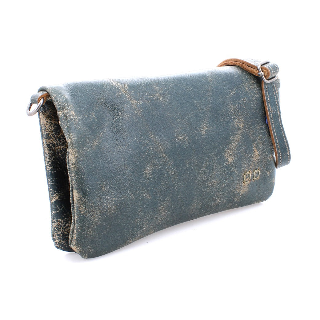 A teal leather Cadence clutch bag with a leather strap, by Bed Stu.