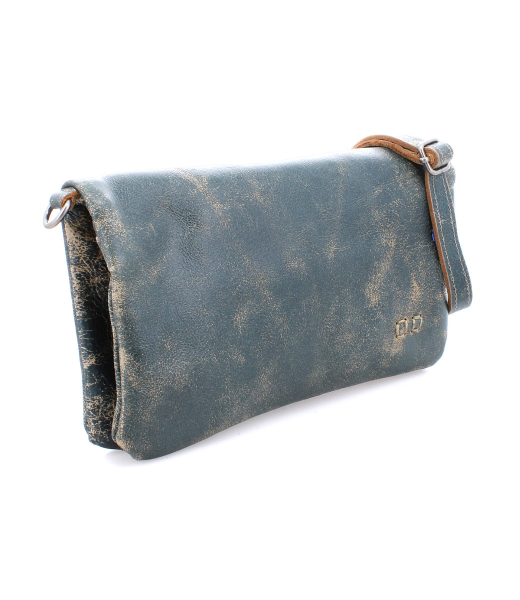 A teal leather Cadence clutch bag with a leather strap, by Bed Stu.