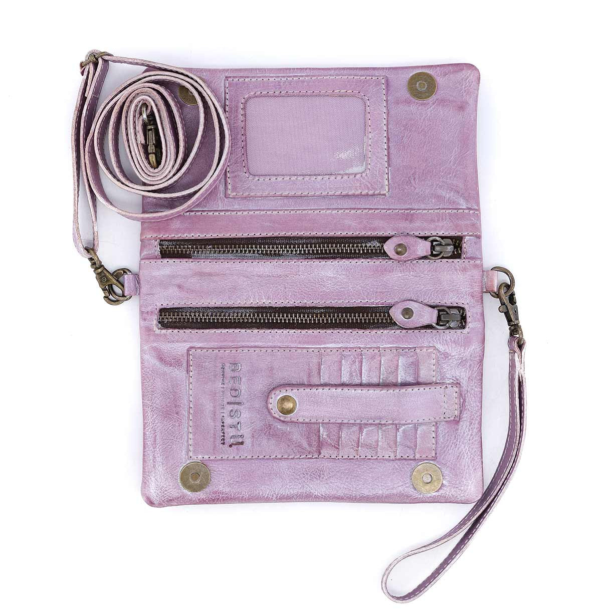 A Cadence by Bed Stu purple leather clutch with a zipper on it.