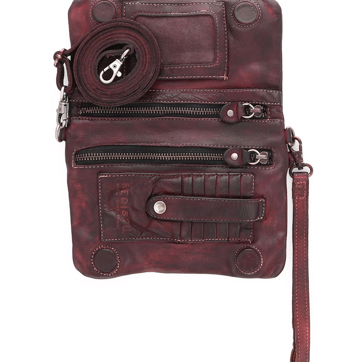 Inside a Cadence burgundy leather clutch bag by Bed Stu.