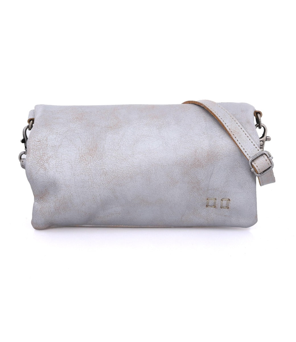 A Bed Stu Cadence silver leather crossbody bag with an adjustable strap.
