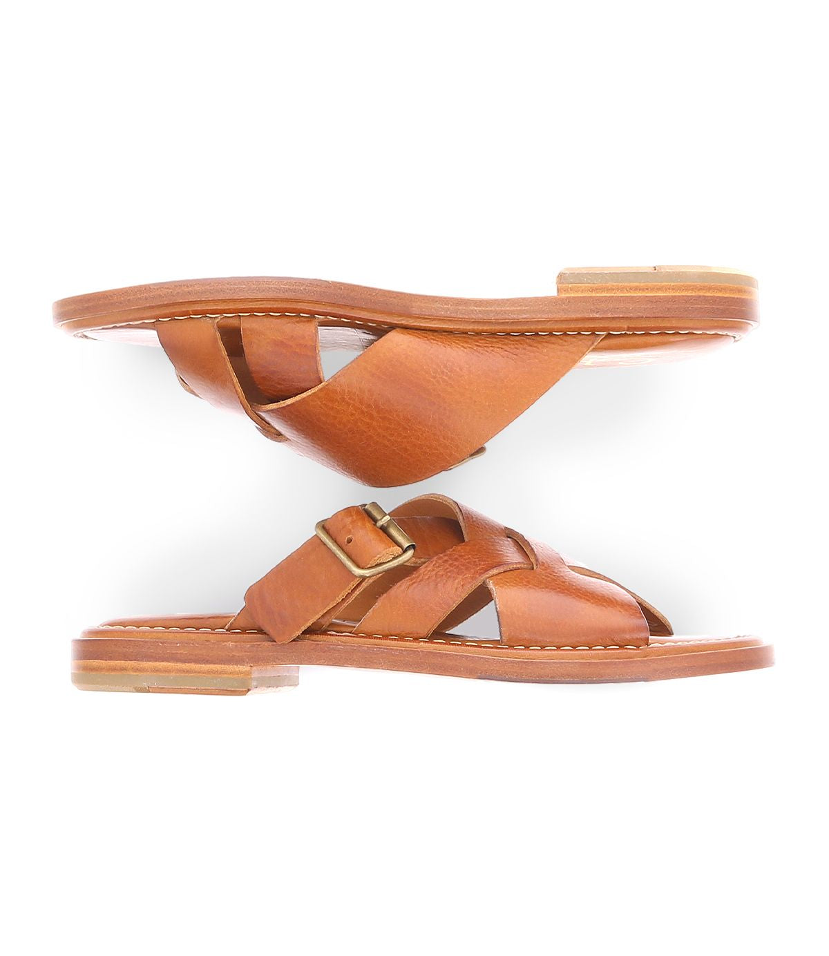A brown slip on Italian leather sandal with a gold buckle product shot.