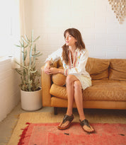 A woman wearing black Callista sandals by Bed Stu.