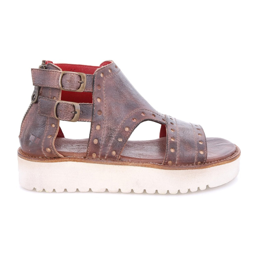 A women's brown leather Camden sandal with studs and a white sole by Bed Stu.